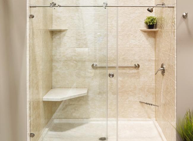 dual sliding doors on bathroom shower with area for sitting