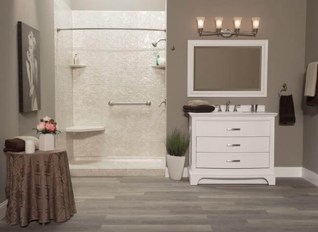 shower in a large bathroom with wooden floors vanity, mirror and table