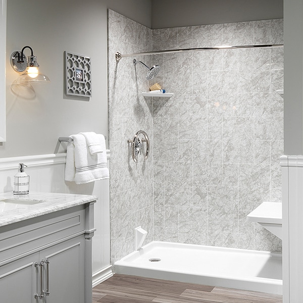 bathroom remodel offering acrylic shower and new vanity design