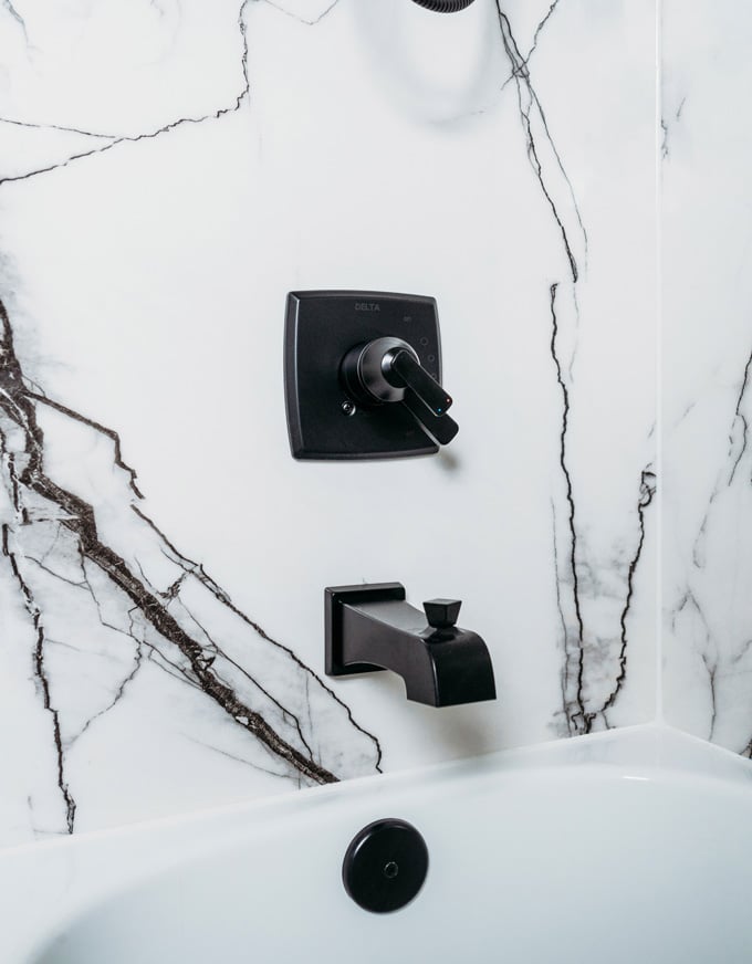 bathroom and tub fixtures against porcelain remodel