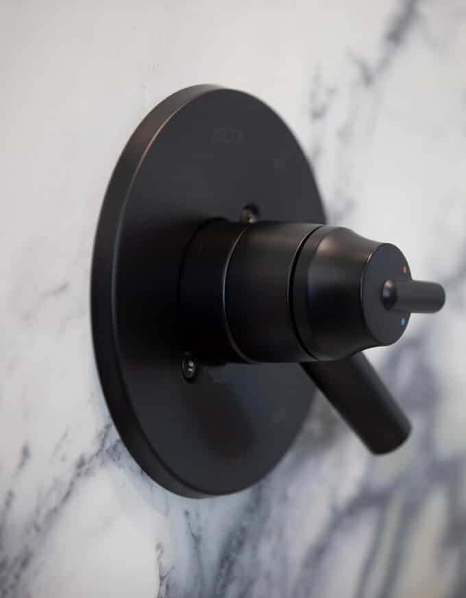 porcelain tile slab wall with decorative shower accessories