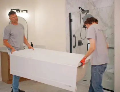 Rome Bath Remodeling Installers carrying a tub to install