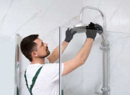 bathroom remodel installer connecting new shower fixtures