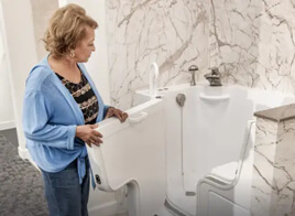 woman opening door for walk in tub