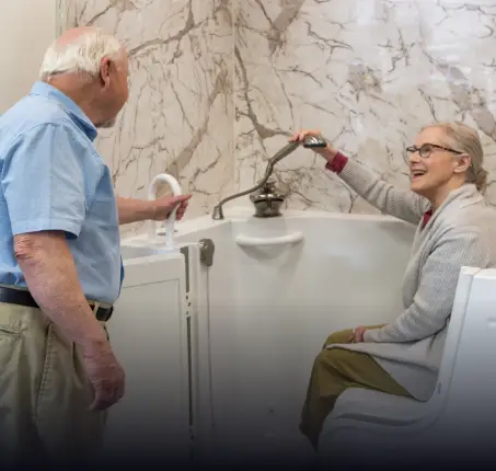 elderly couple exploring the new features of walk-in tubs