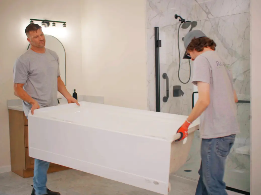 Rome Bath Remodeling Employees installing a bathtub