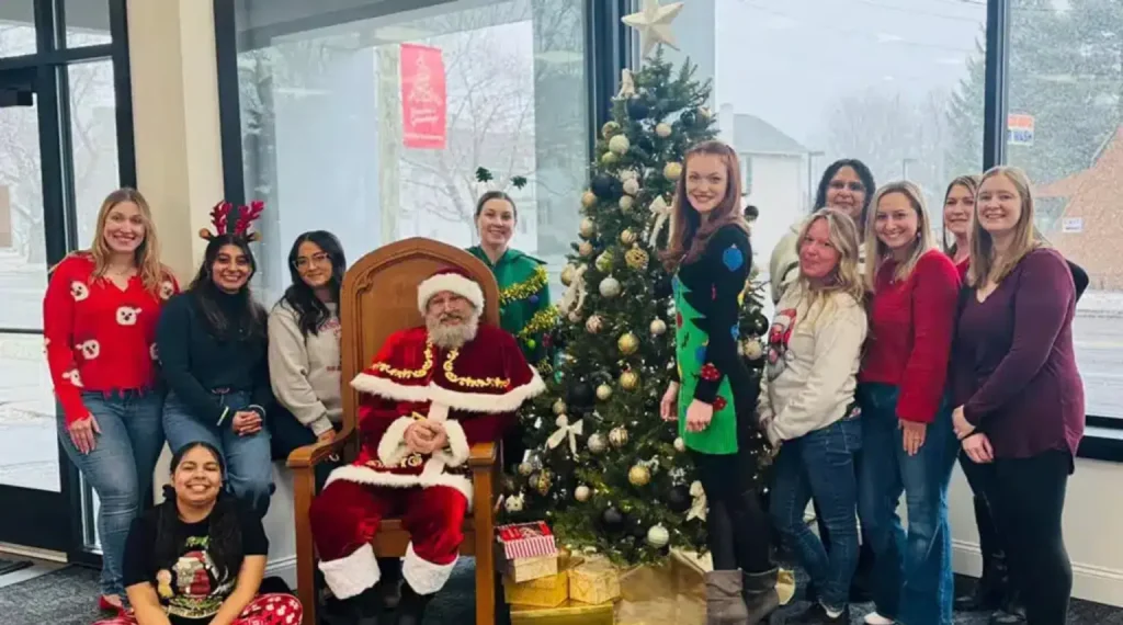 rome bath remodeling employees with christmas tree and decorations inside of the team's showroom