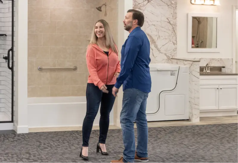 happy couple exploring the rome bath remodeling show room and design center