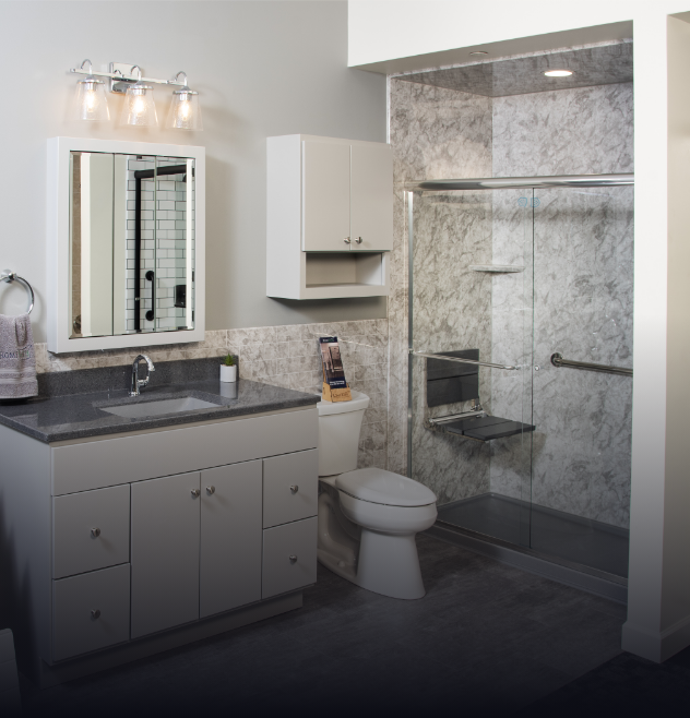 full bathroom remodel by Rome Bath Remodeling which features a new vanity, lighting, flooring, walk-in shower, toilet, etc.