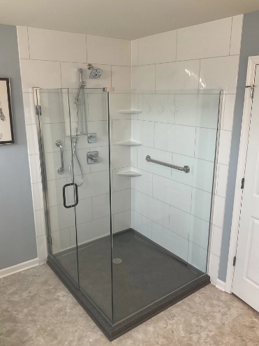 walk-in shower bathroom remodel with glass panels and door