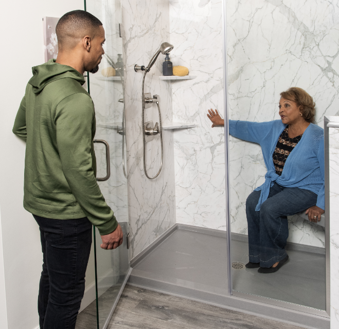 two customers shopping for a walk in shower at rome bath remodeling show room and design center