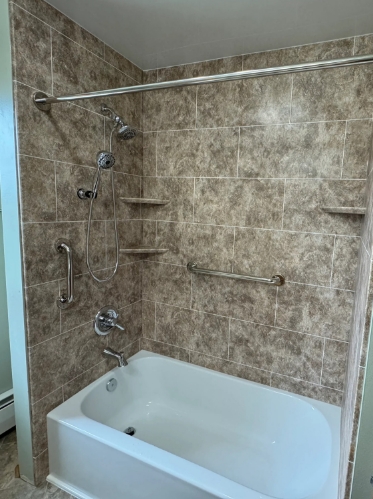 bath tub and tile wall surrounds