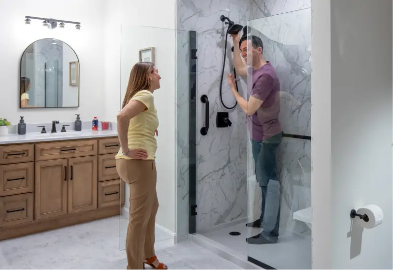 Young couple excited about their new walk-in shower