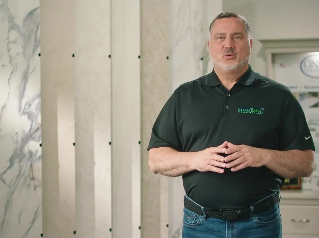 Rich Rome standing in front of large format porcelain tile slabs